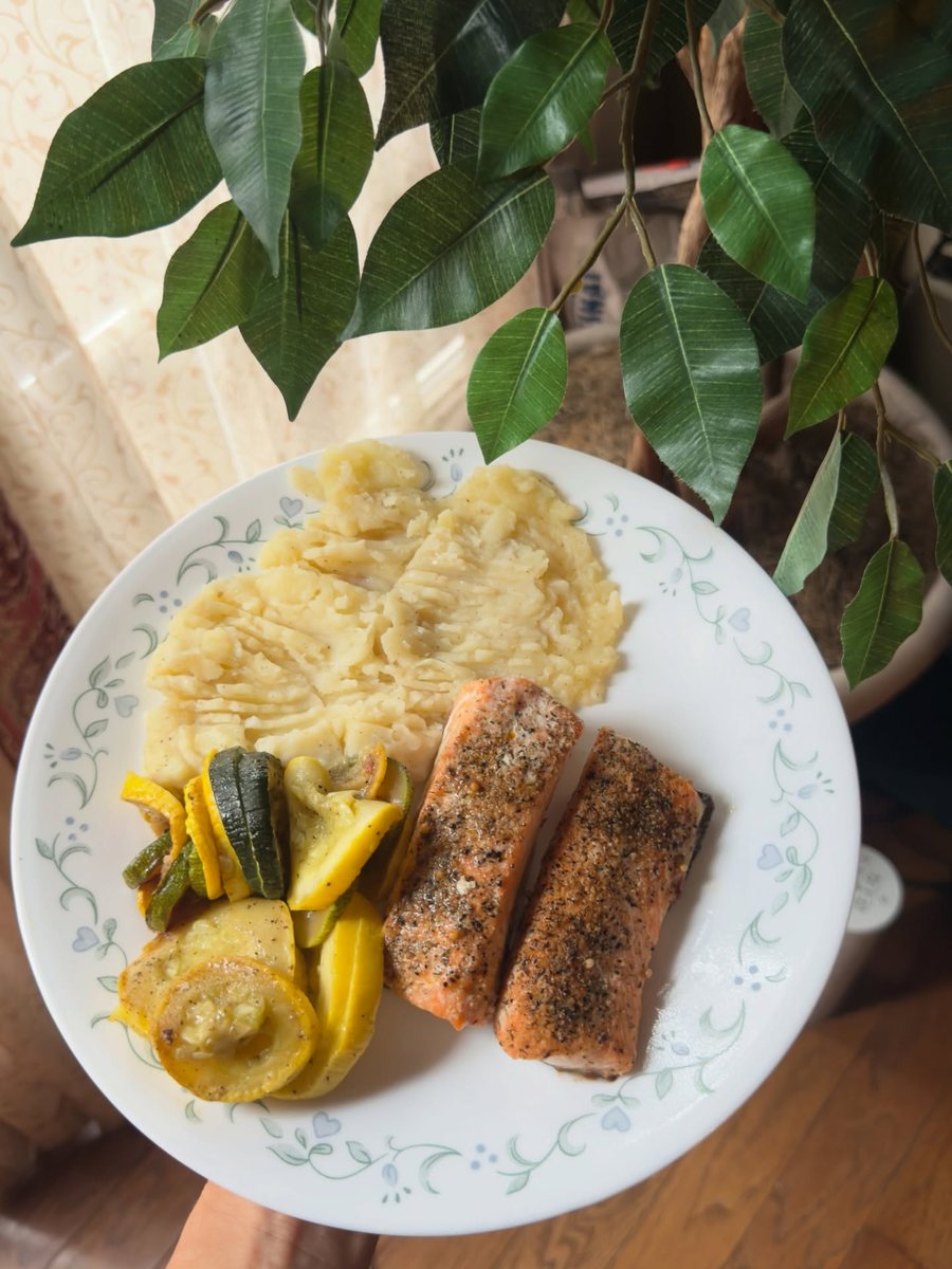 Salmon, squash and mashed potato on a plate
